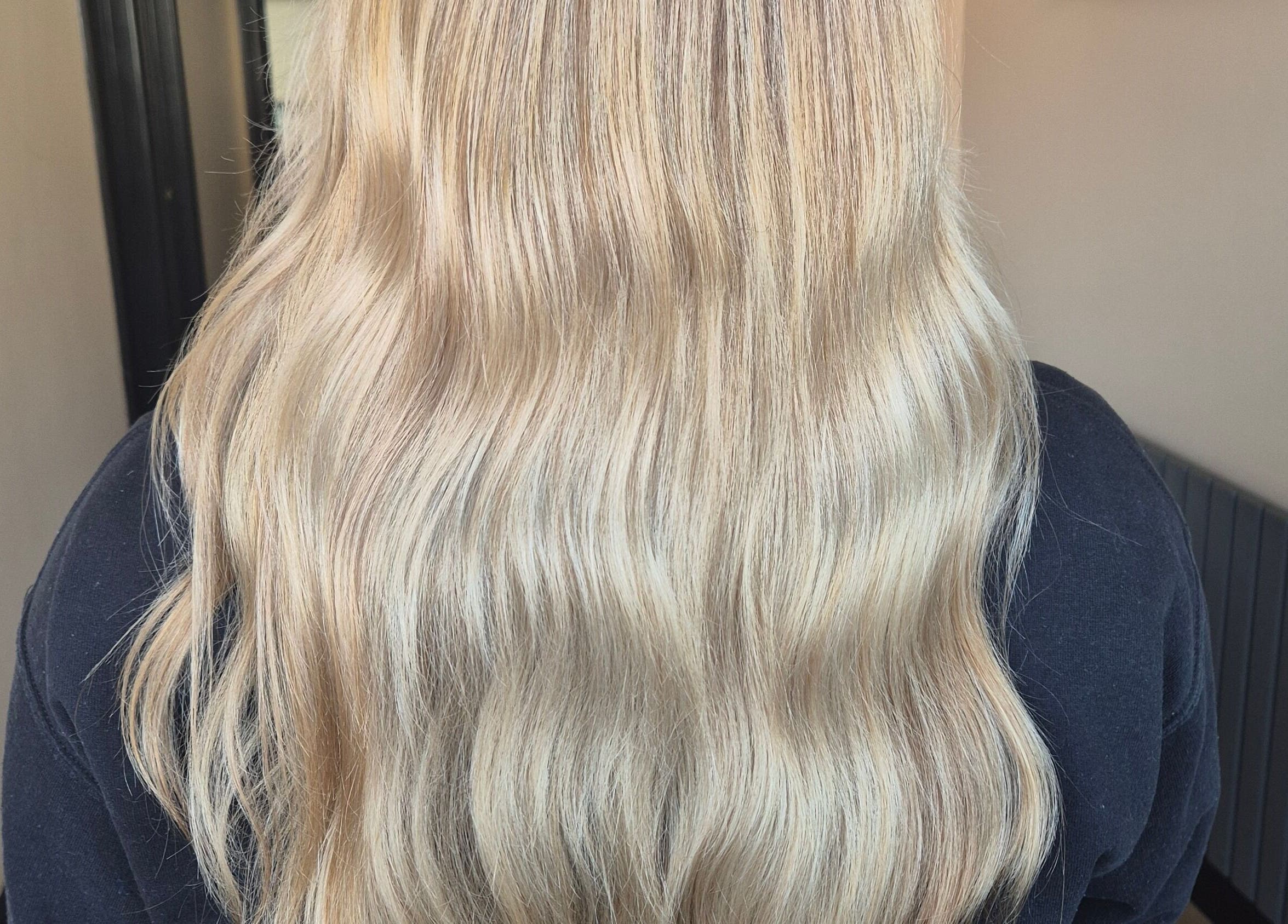 Blonde wavy hair styled at Brushed Salon, Penarth, Wales, GB.