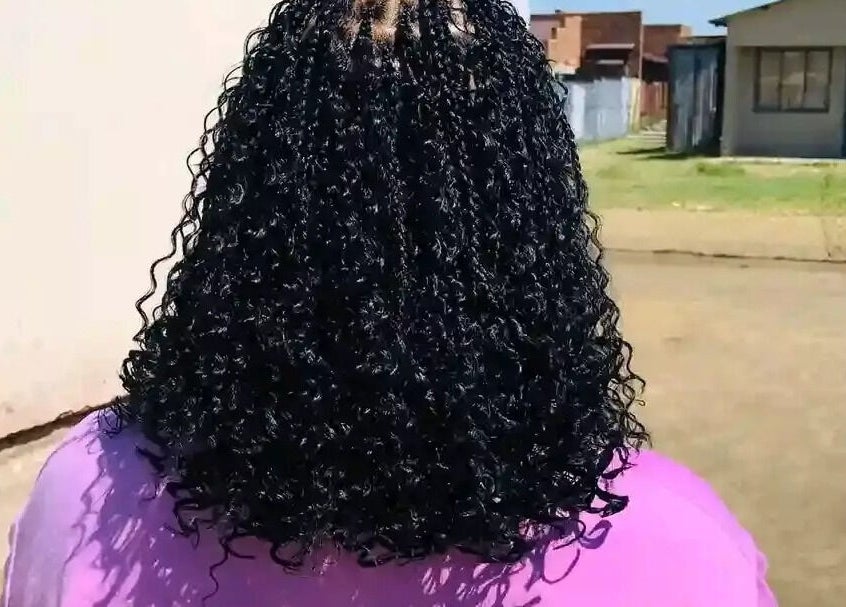 Back view of styled curly hair at Nomsa's beauty salon in Vanderbijlpark, Gauteng, ZA.