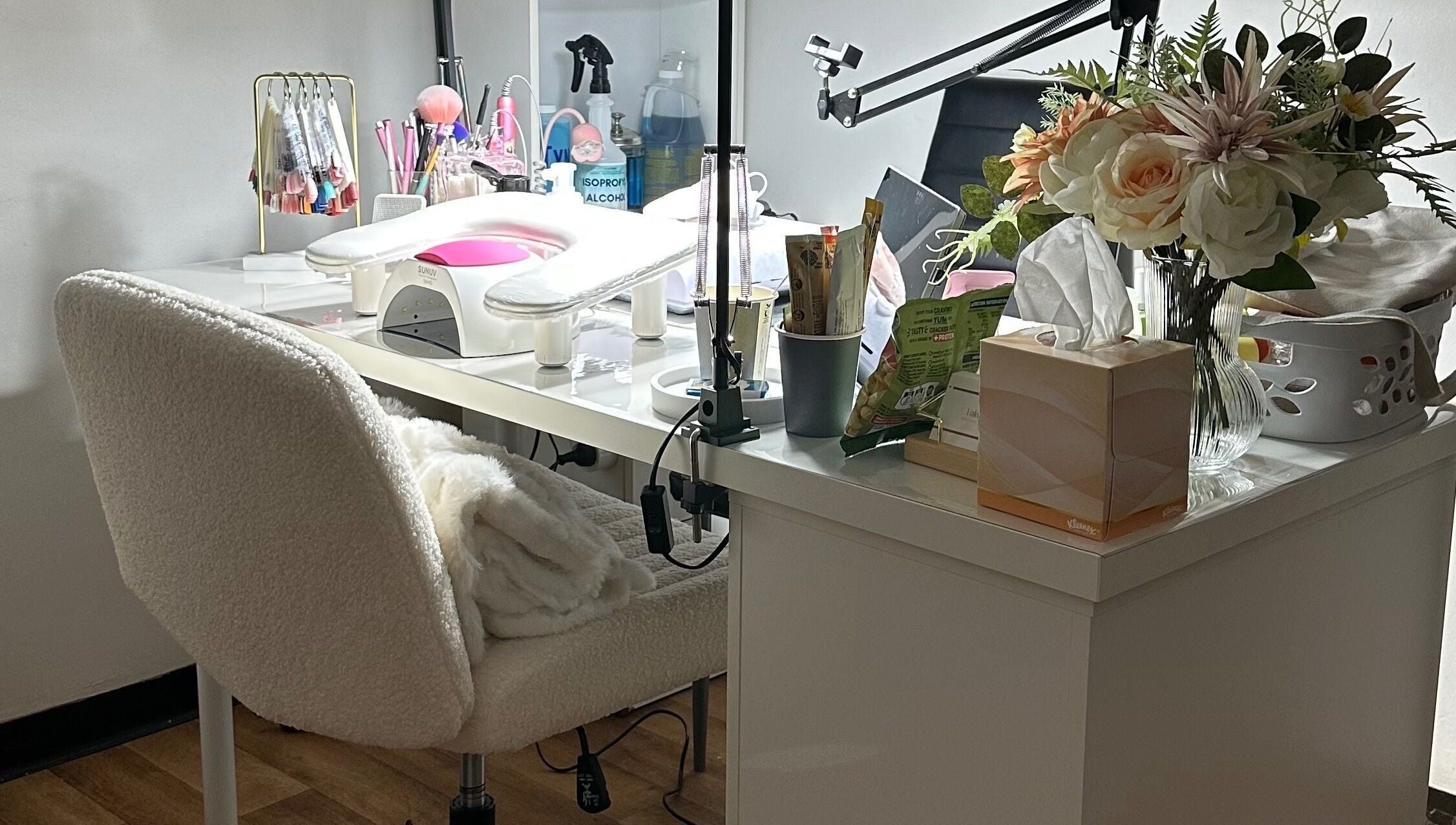 Elegant nail station at Valen Nails, Croydon, South Australia, showcasing tools and floral decor.
