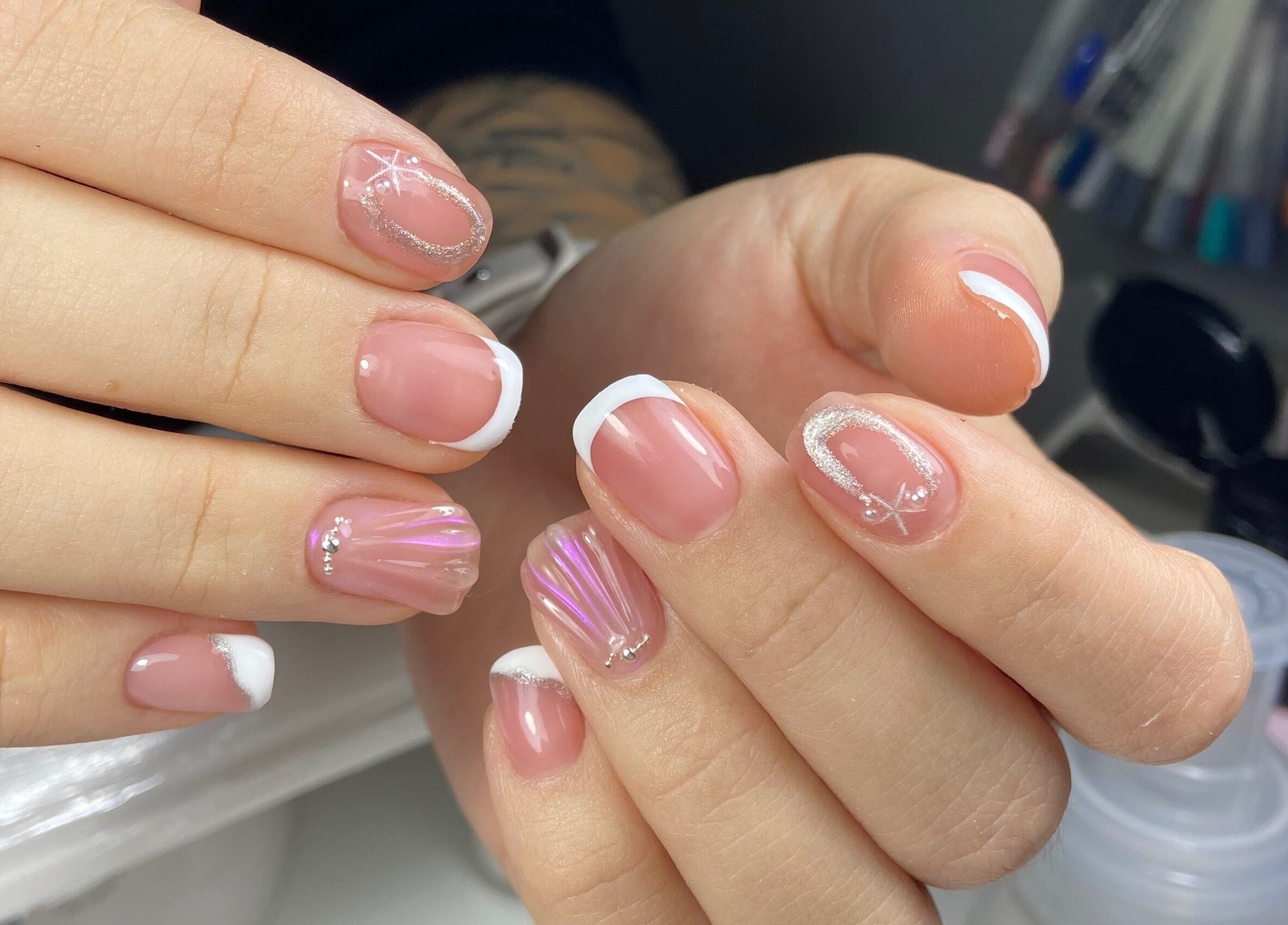 Elegant manicure at Valen Nails, Croydon, South Australia, AU showcasing French tips and sparkling nail art.