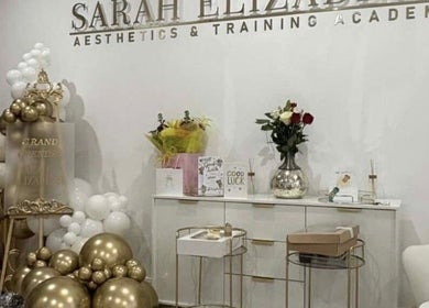 Luxe Haven Cosmetics reveals a grand opening display in Bradford, England, GB, with elegant decor and flowers.
