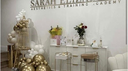 Luxe Haven Cosmetics reveals a grand opening display in Bradford, England, GB, with elegant decor and flowers.