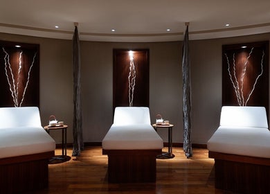 Relaxing treatment beds in a serene room at Zayna Spa, Abu Dhabi, Abu Dhabi, AE, offering a peaceful ambiance.