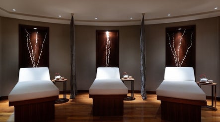 Relaxing treatment beds in a serene room at Zayna Spa, Abu Dhabi, Abu Dhabi, AE, offering a peaceful ambiance.