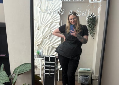 Beautician poses at Nails by Becs in Desborough, England, GB, reflecting elegant salon decor.