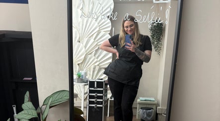 Beautician poses at Nails by Becs in Desborough, England, GB, reflecting elegant salon decor.