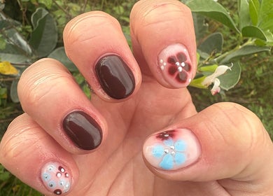 Close-up of floral nail art by Nails by Becs in Desborough, England, GB. Vibrant colors with detailed design.