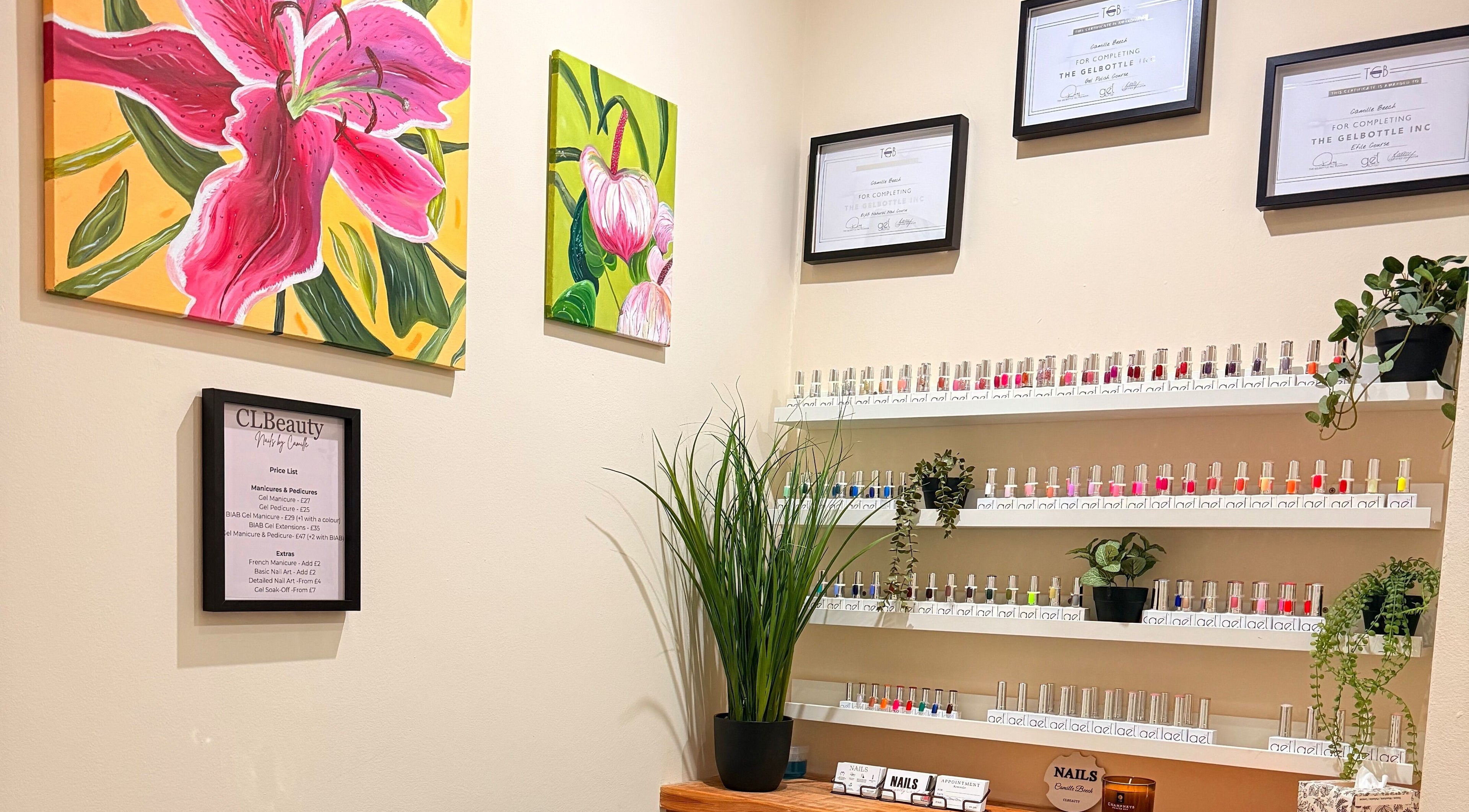 CLBeauty - at Rose Gold Hair in Sheffield, England, features vibrant wall art and a nail polish display.