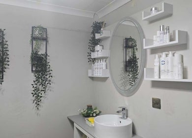 Elegant vanity with plants and products at Ray's House of Beauty, Hounslow, England, GB.