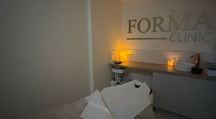 Tranquil massage room at Relaxed by Kelly in Edinburgh, GB with soft lighting and cozy therapy table.