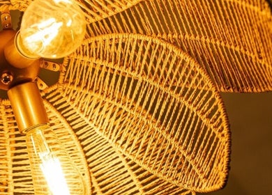Elegant woven lamp at Hebra Beauty Studio, Guaynabo, Guaynabo, PR, casting warm light.