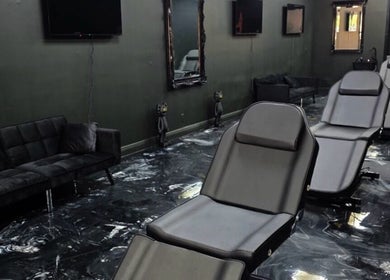 Modern and sleek interior of Perfect Match Ink in Margate, Florida, US with stylish seating and decor.