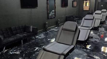 Modern and sleek interior of Perfect Match Ink in Margate, Florida, US with stylish seating and decor.
