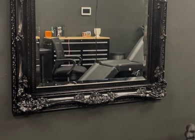 Elegant interior of Perfect Match Ink with ornate mirror in Margate, Florida, US.