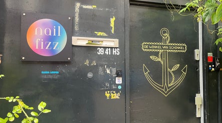 Entrance of Lovers & Fighters @ Nail Fizz, Amsterdam, Noord-Holland, NL with colorful sign and anchor graphic.