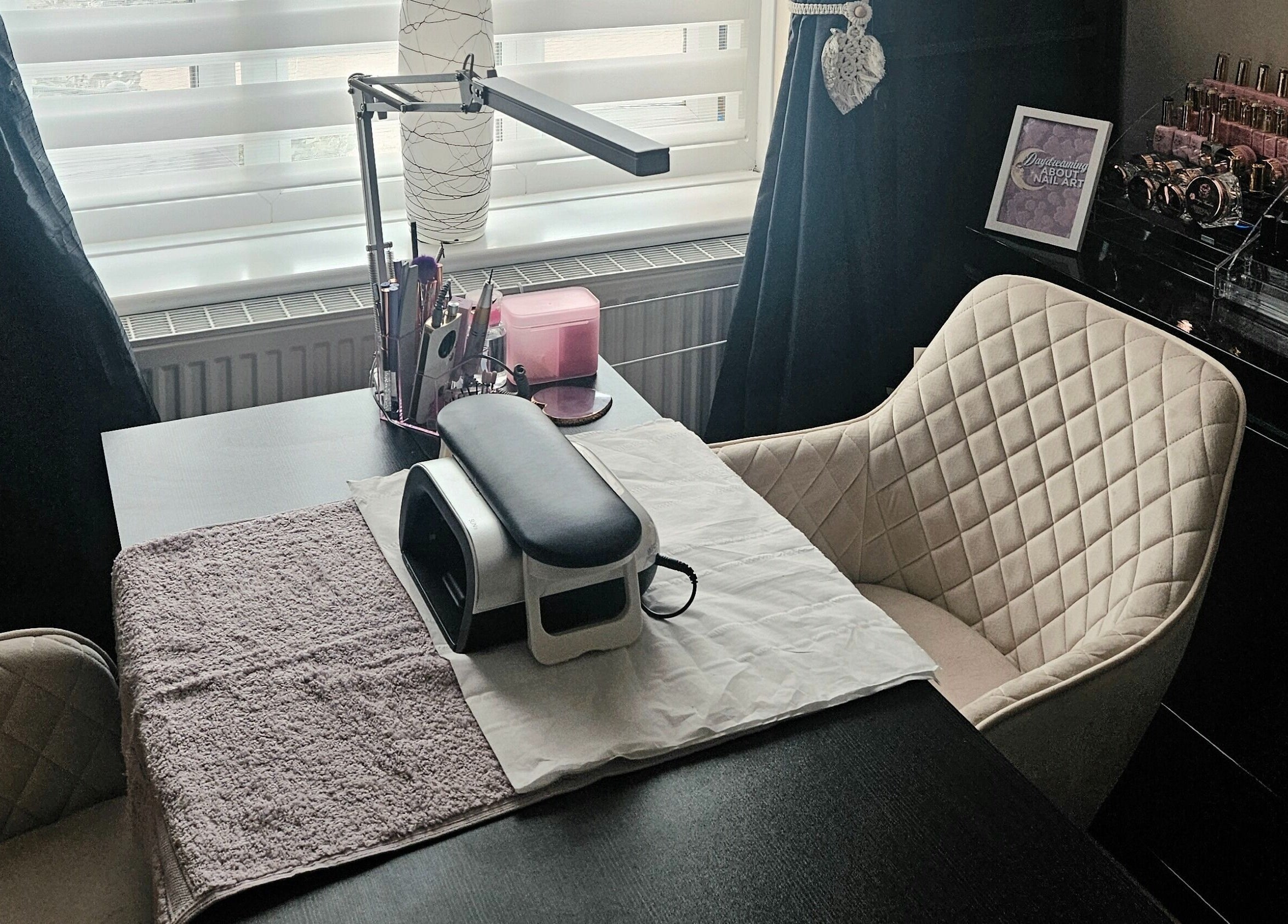 Elegant nail station at Lavender Luxe Nails, Somersham, England, GB, showcasing cozy chairs and nail tools.