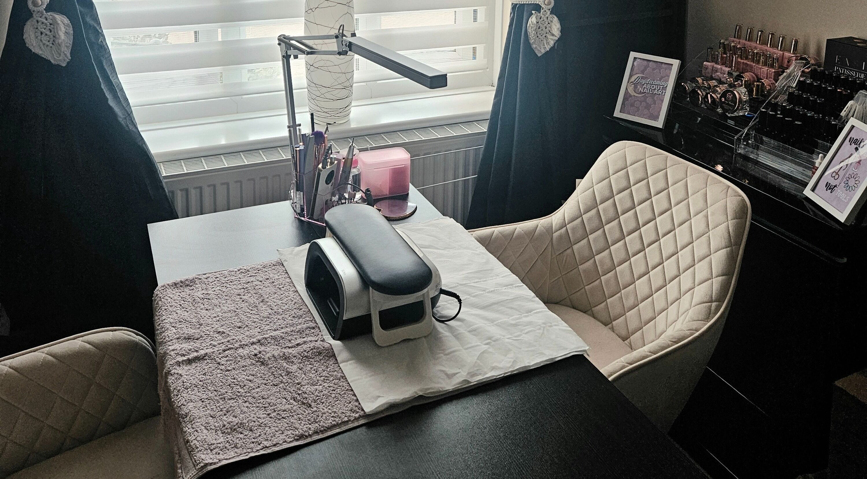 Elegant nail station at Lavender Luxe Nails, Somersham, England, GB, showcasing cozy chairs and nail tools.