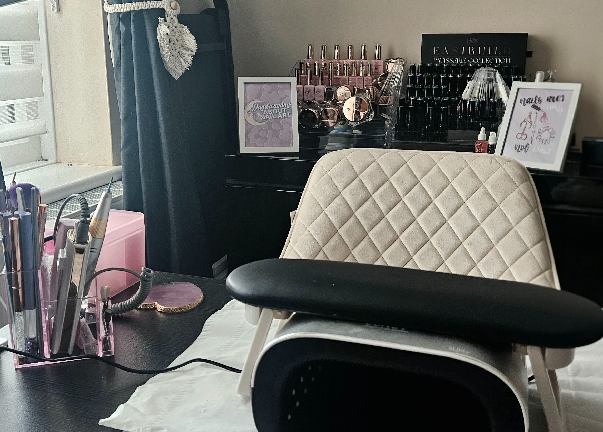 Elegant nail station at Lavender Luxe Nails, Somersham, England, GB, showcasing premium tools and polishes.