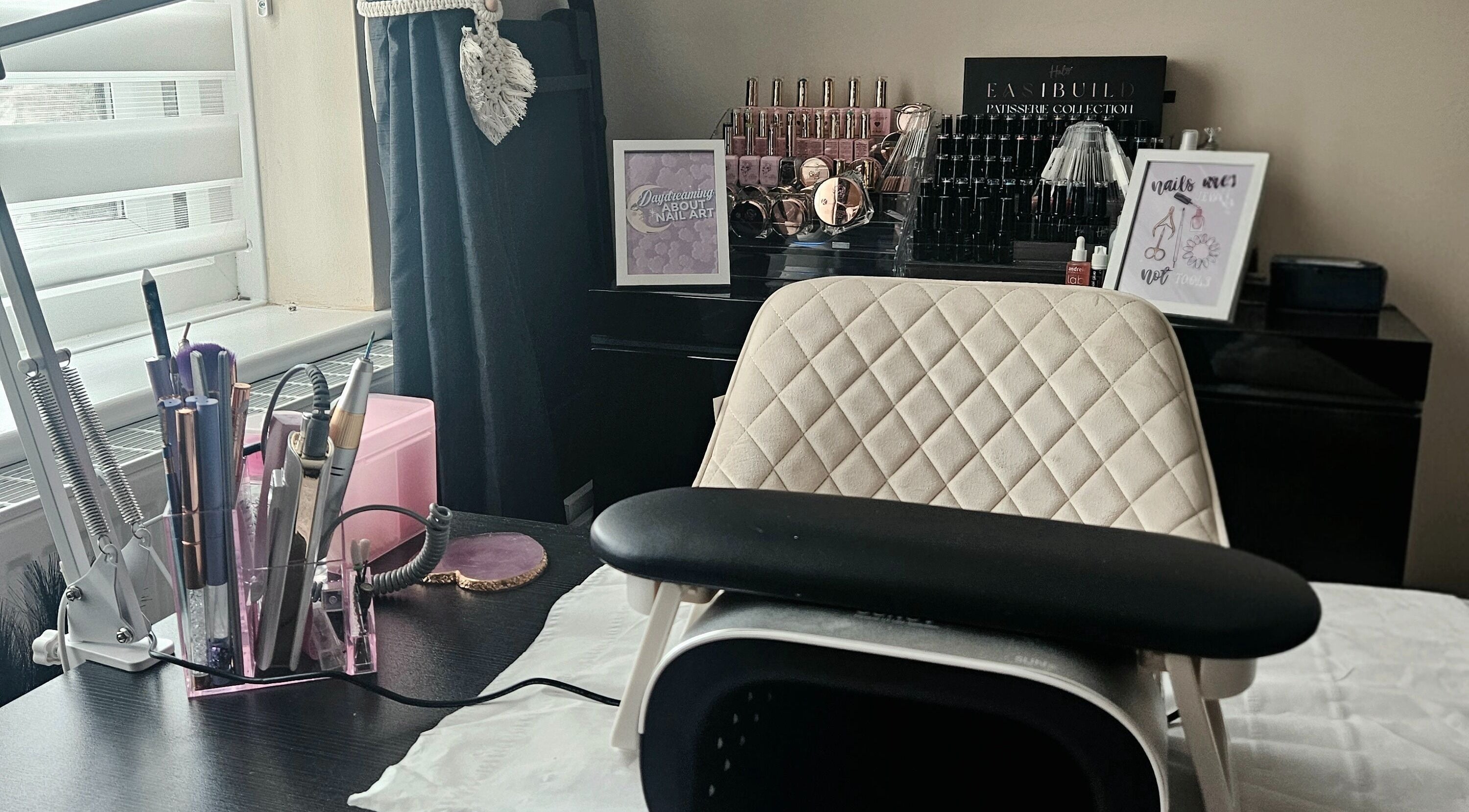 Elegant nail station at Lavender Luxe Nails, Somersham, England, GB, showcasing premium tools and polishes.