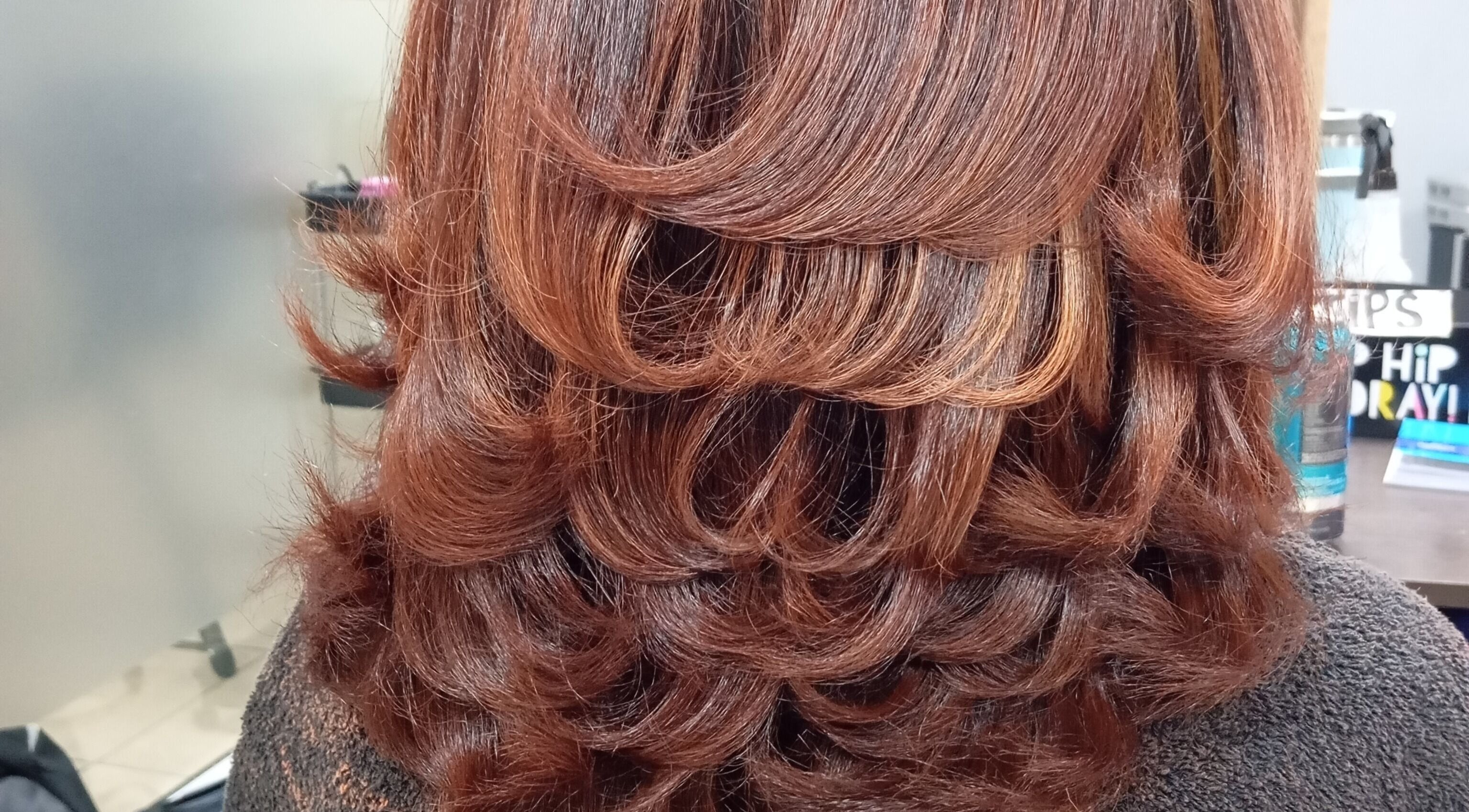 Lustrous layered hairstyle at Belindah the Hairdresser, Cape Town, Western Cape, ZA. Perfect for all occasions.