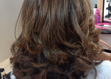 Stylish curled hairstyle at Belindah the Hairdresser in Cape Town, Western Cape, ZA.