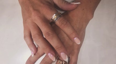 Elegant pink manicure with rings at Polished and Pretty, Crynant, Wales, GB.