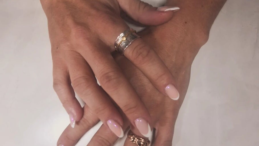 Elegant manicured hands with rings at Polished and Pretty, Crynant, Wales, GB.