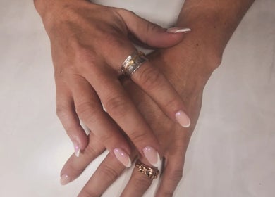 Elegant manicured hands with rings at Polished and Pretty, Crynant, Wales, GB.