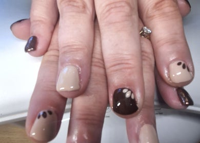 Brown and beige nail art at Polished and Pretty in Crynant, Wales, GB, showcasing intricate design.