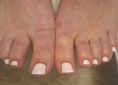 A perfect pedicure with light pink polish at Polished and Pretty, Crynant, Wales, GB.
