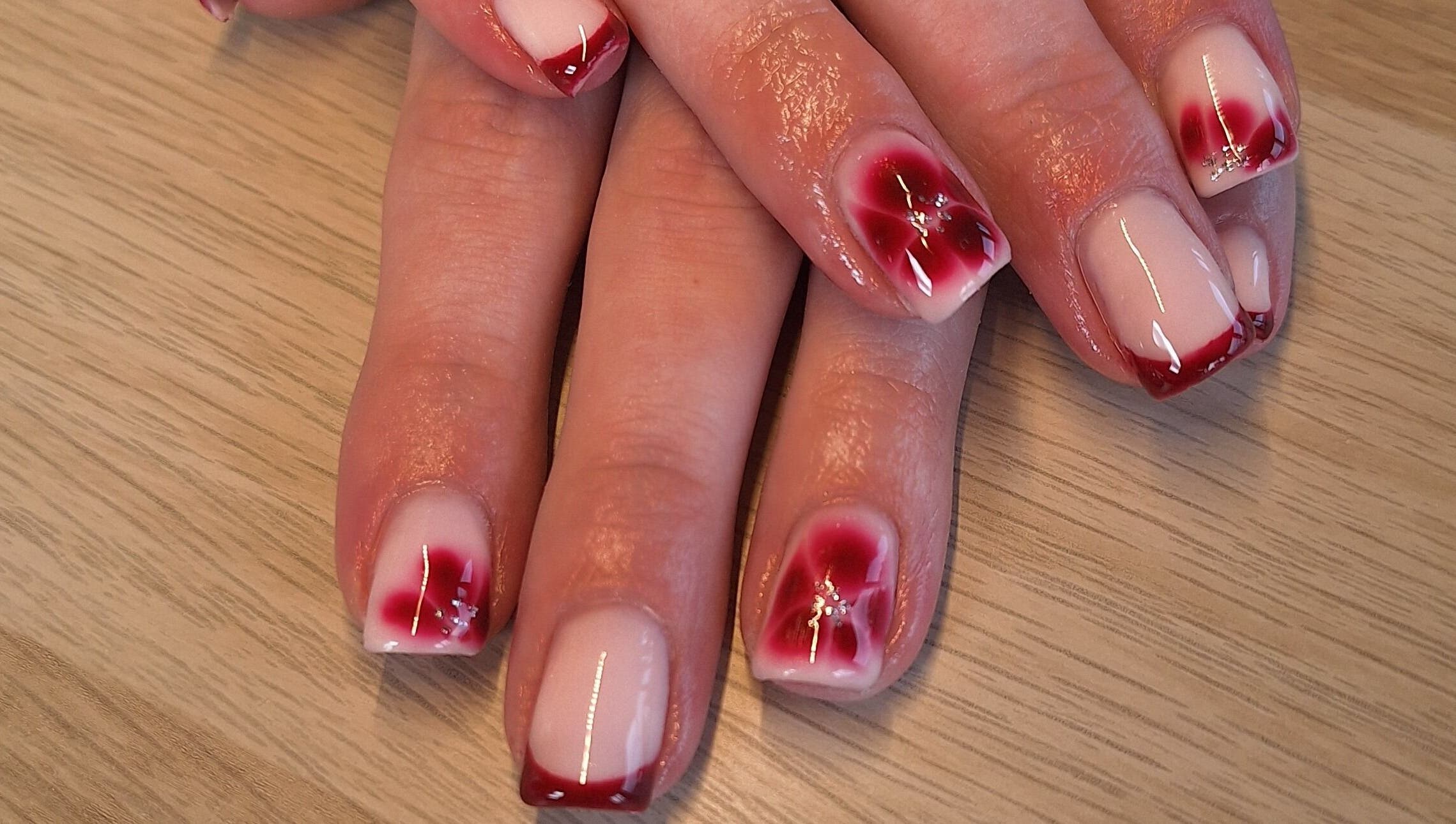Beautiful red nail art at Polished and Pretty, Crynant, Wales, GB.