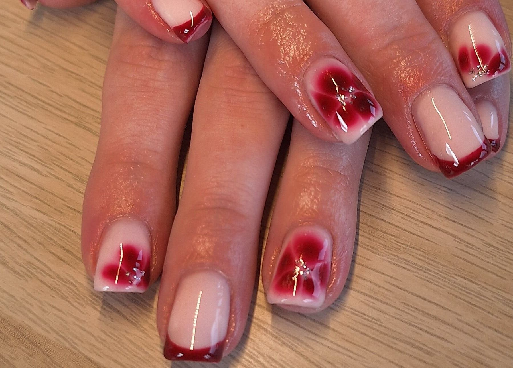 Beautiful red nail art at Polished and Pretty, Crynant, Wales, GB.