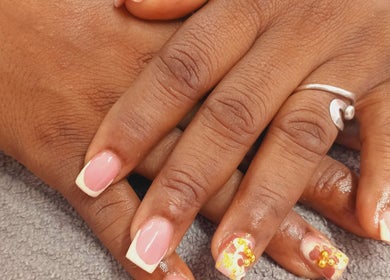 Elegant nail art with pink and floral accents at Luv Ur Nails, Roseau, Saint George Parish, DM.