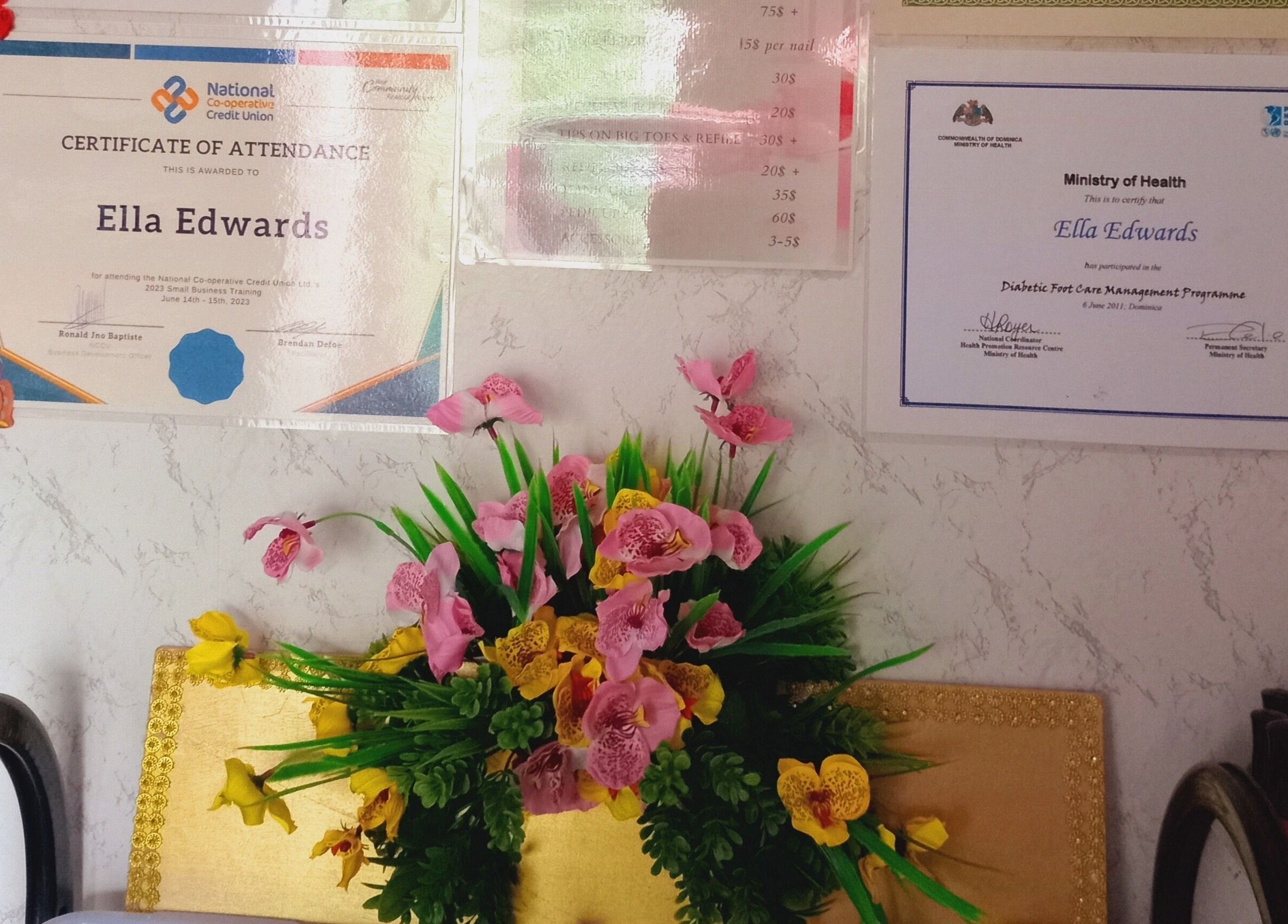 Certificates and floral decor at Luv Ur Nails, Roseau, Saint George Parish, DM.