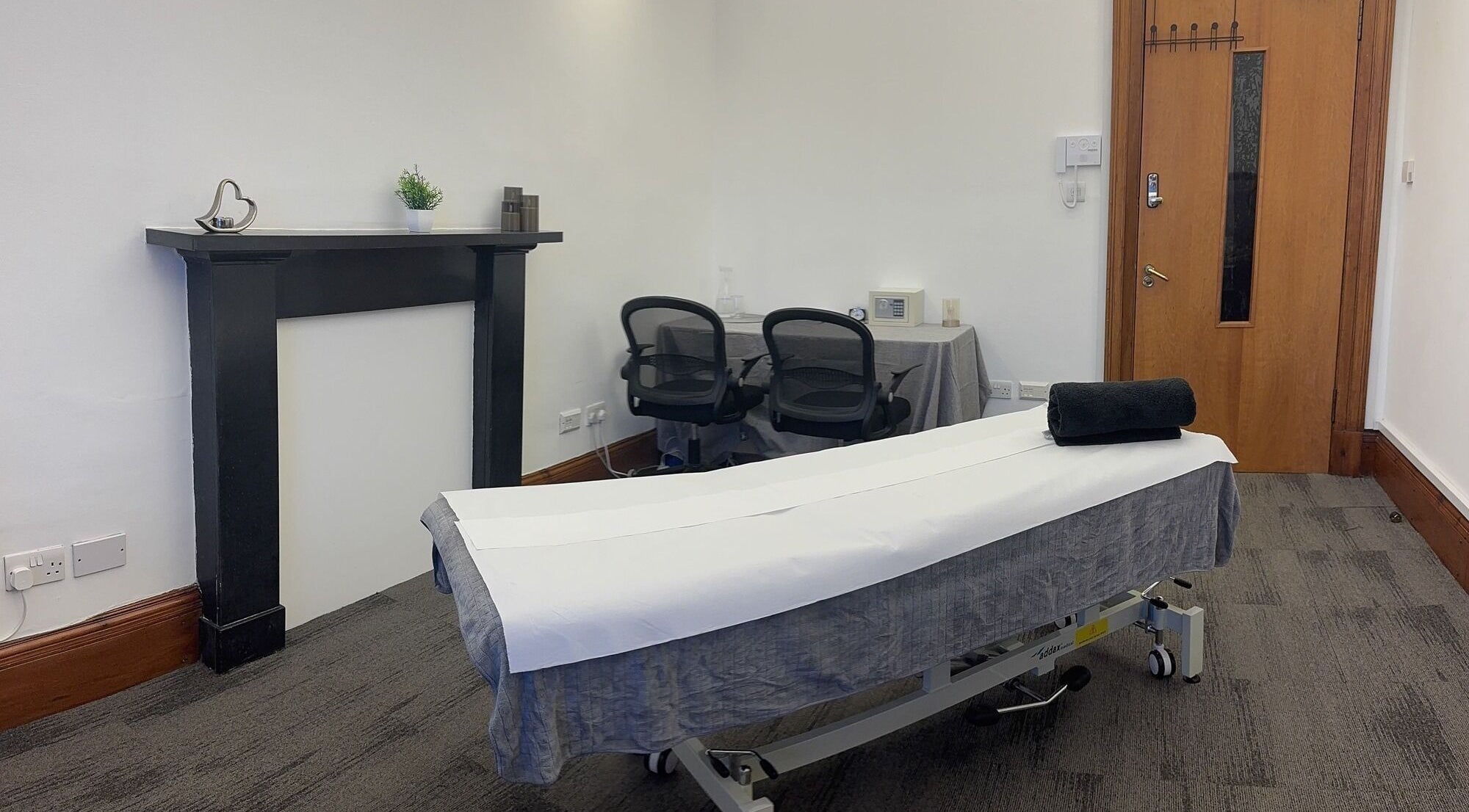 Calm massage room at Holistic & Sports Massage, Edinburgh, Scotland, GB, featuring a neatly prepared massage table.