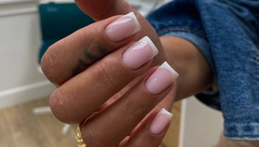 French manicure at Nail Maniac Salon & Academy, Orlando, Florida, US. Elegant pink and white nail design.