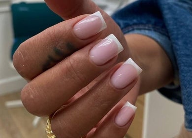 French manicure at Nail Maniac Salon & Academy, Orlando, Florida, US. Elegant pink and white nail design.