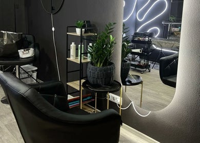 VixenChair's modern salon interior with sleek black chairs in Concord, North Carolina, US.