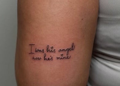 Tattooed phrase on arm at Nail and Needle Clinic in Great Warley, England, GB.