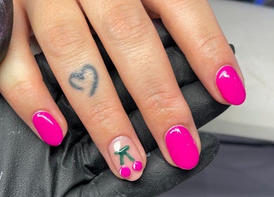 Vibrant pink manicure with cherry nail art at Nail and Needle Clinic, Great Warley, England, GB.