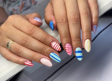 Beautiful striped nail art at Nail and Needle Clinic in Great Warley, England, GB.