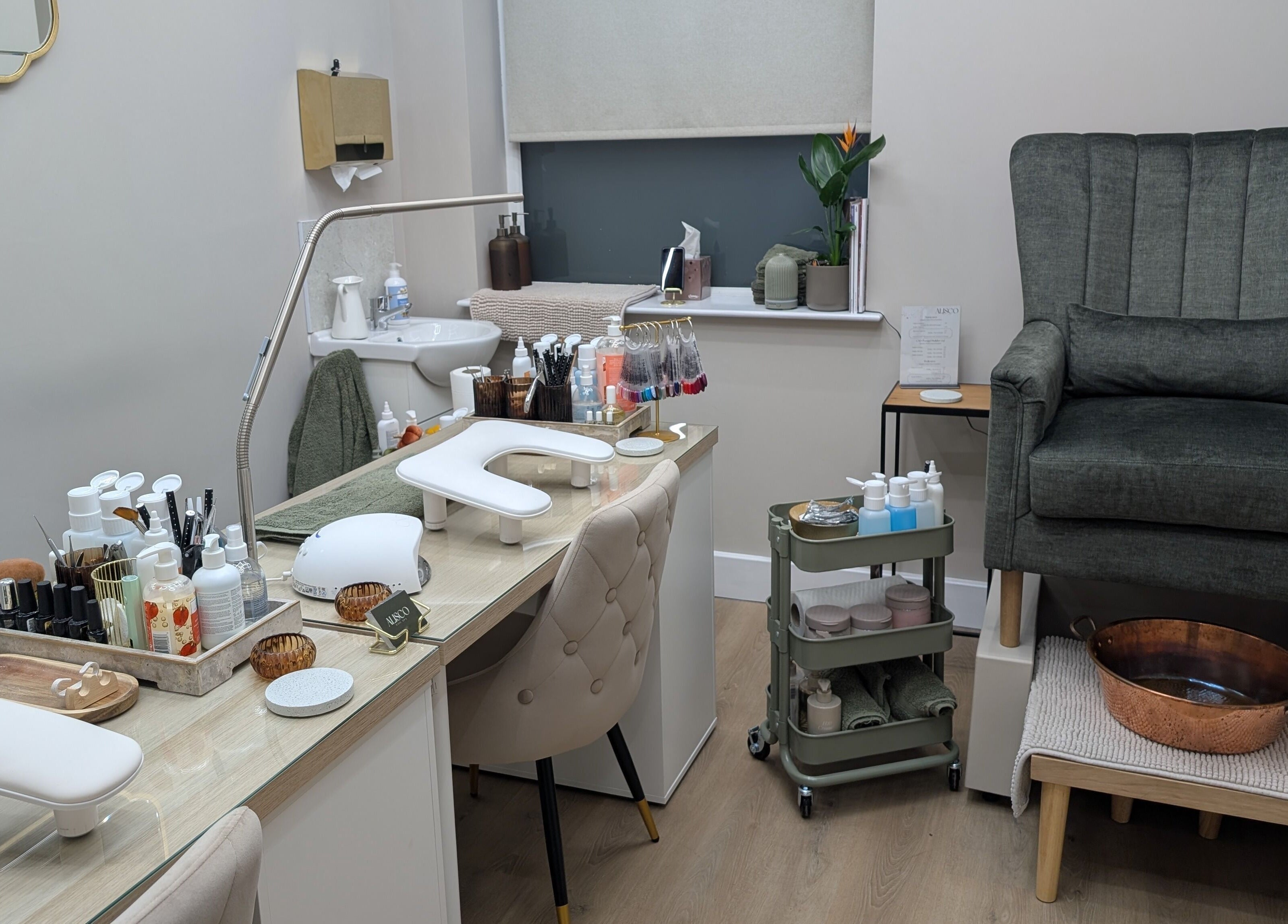 Alisco Nail Spa manicure station in Shipley, England, GB, featuring luxury seating and nail care tools.