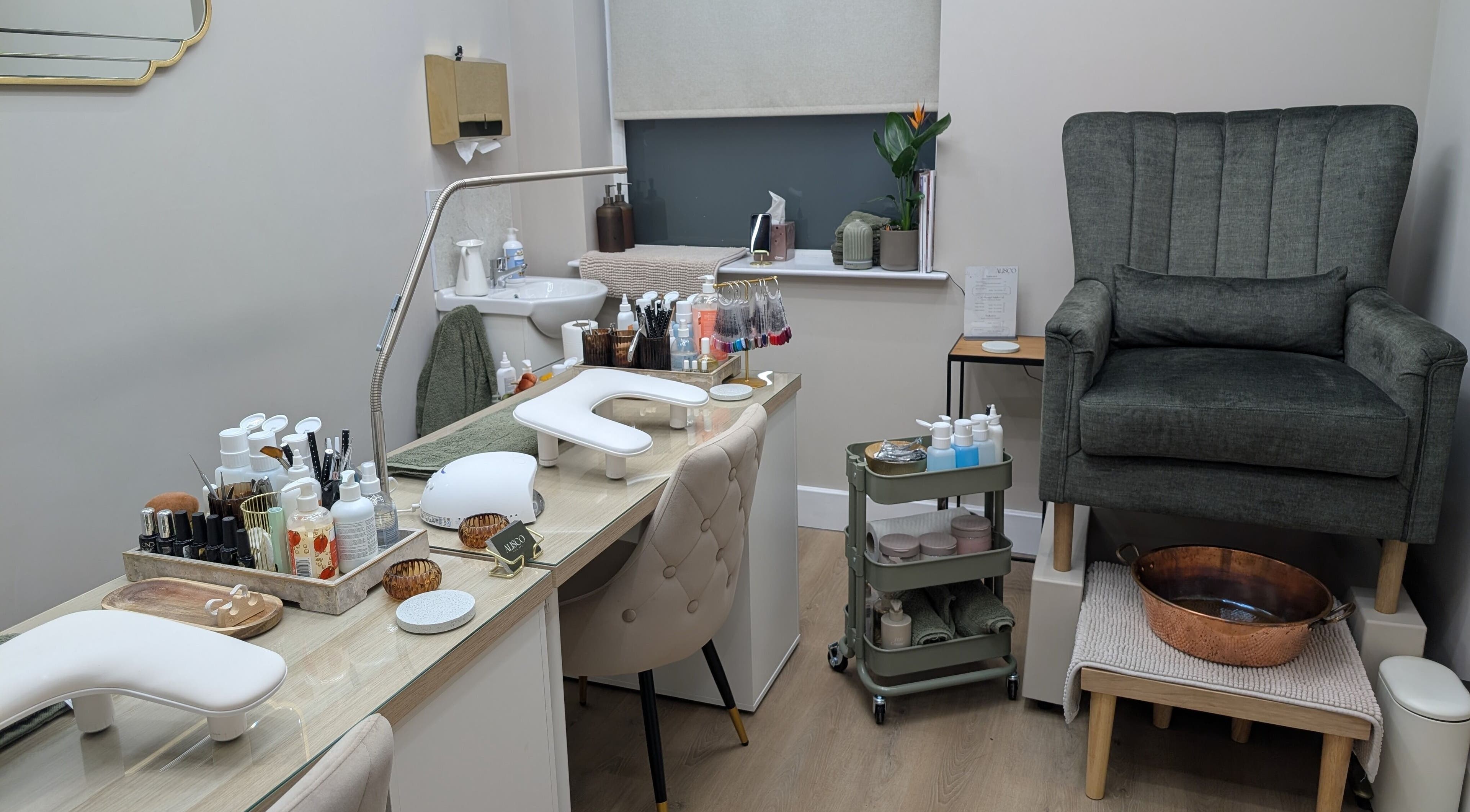 Alisco Nail Spa manicure station in Shipley, England, GB, featuring luxury seating and nail care tools.