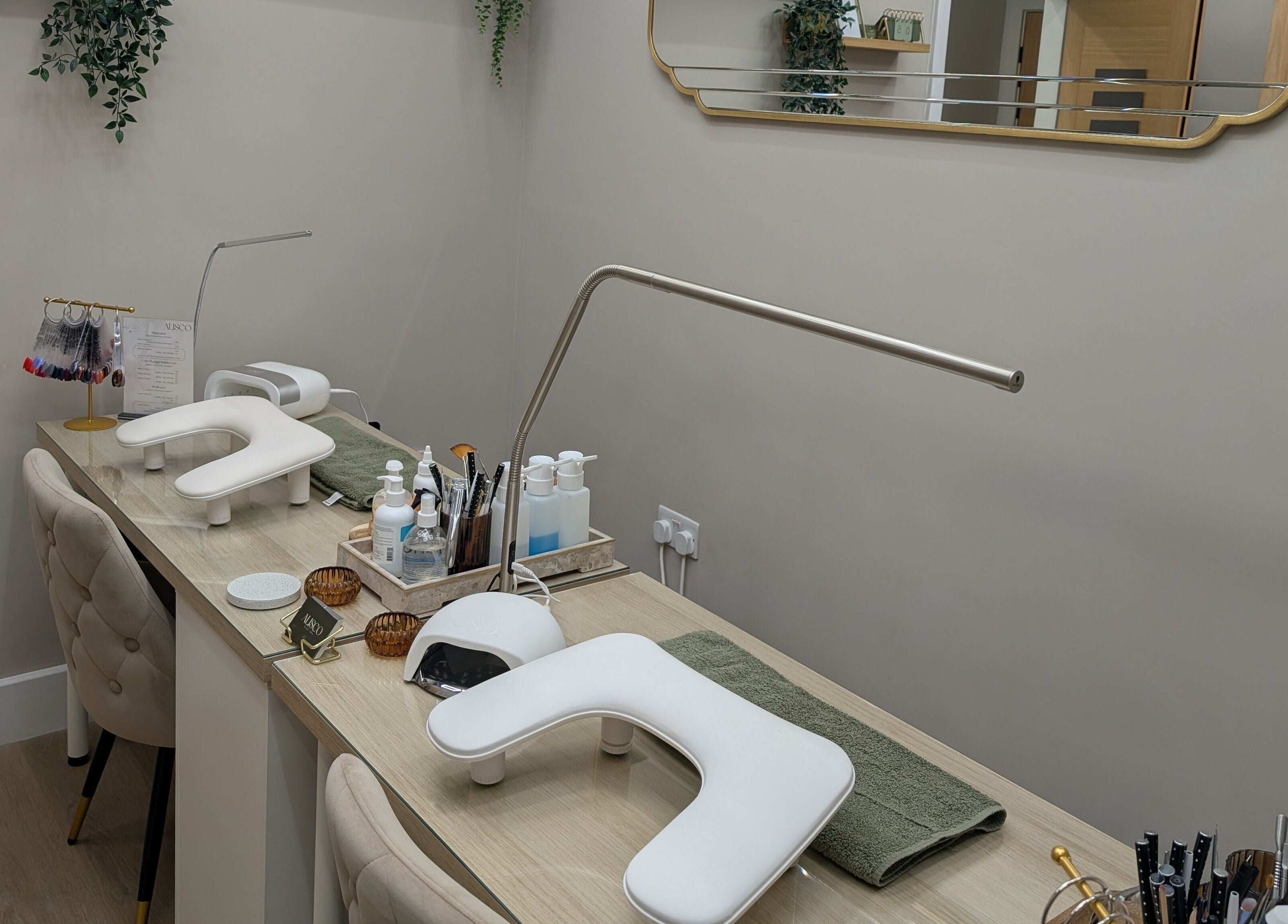 Modern nail station at Alisco Nail Spa in Shipley, England, GB, showcasing manicure tools and comfortable seating.