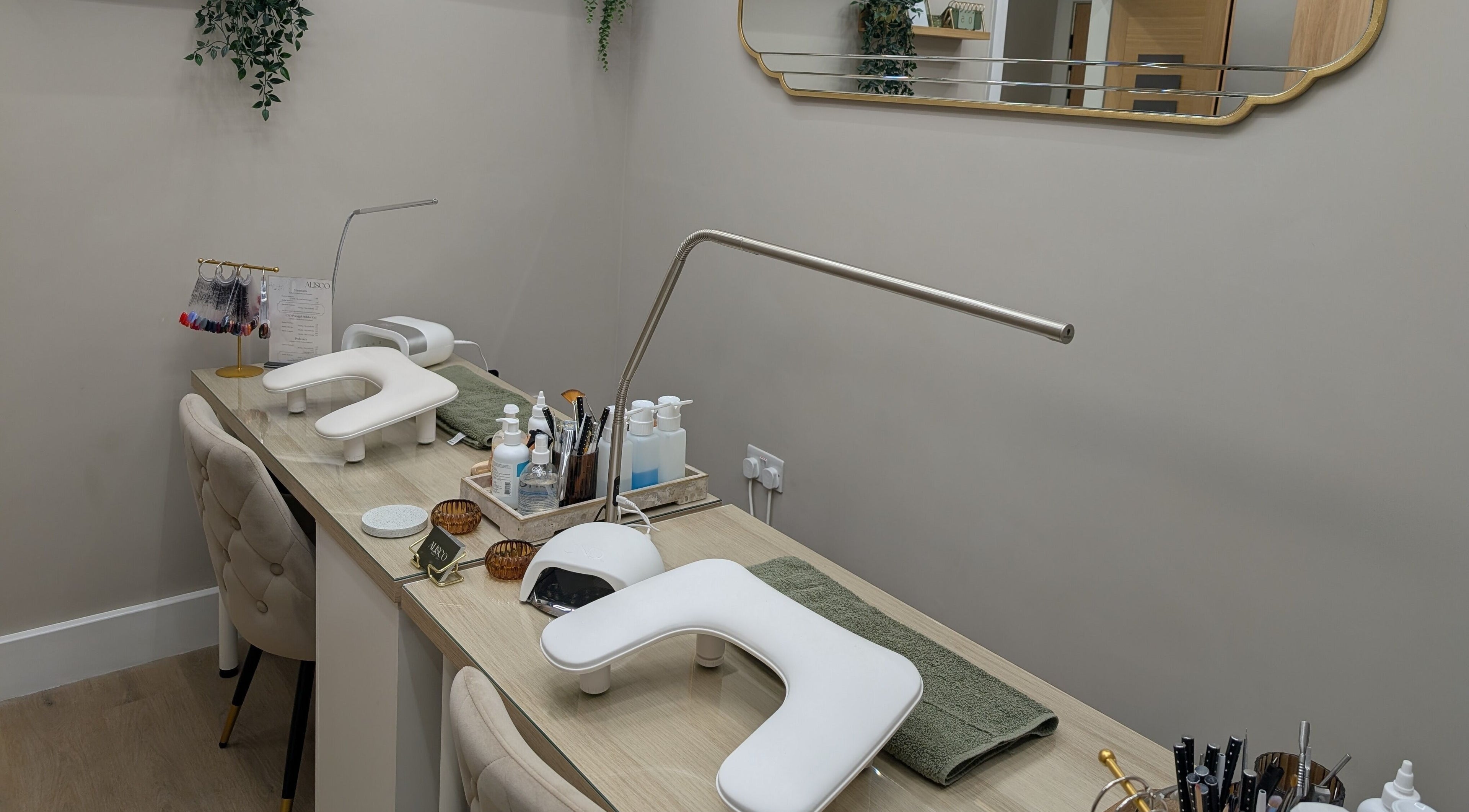 Modern nail station at Alisco Nail Spa in Shipley, England, GB, showcasing manicure tools and comfortable seating.