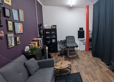 Relaxing interior of Shadow Bloom Studio, Oldham, England, GB with a modern couch and wall art.
