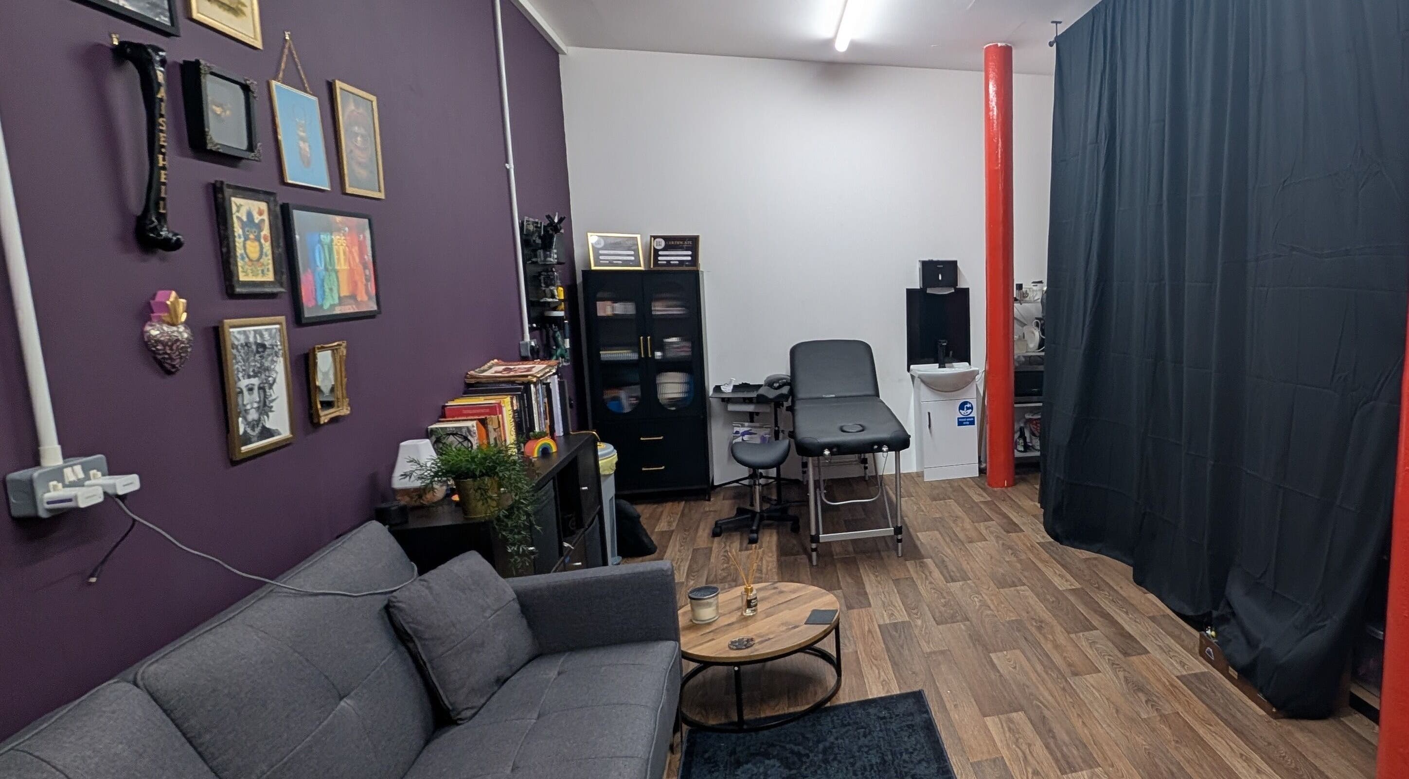 Relaxing interior of Shadow Bloom Studio, Oldham, England, GB with a modern couch and wall art.