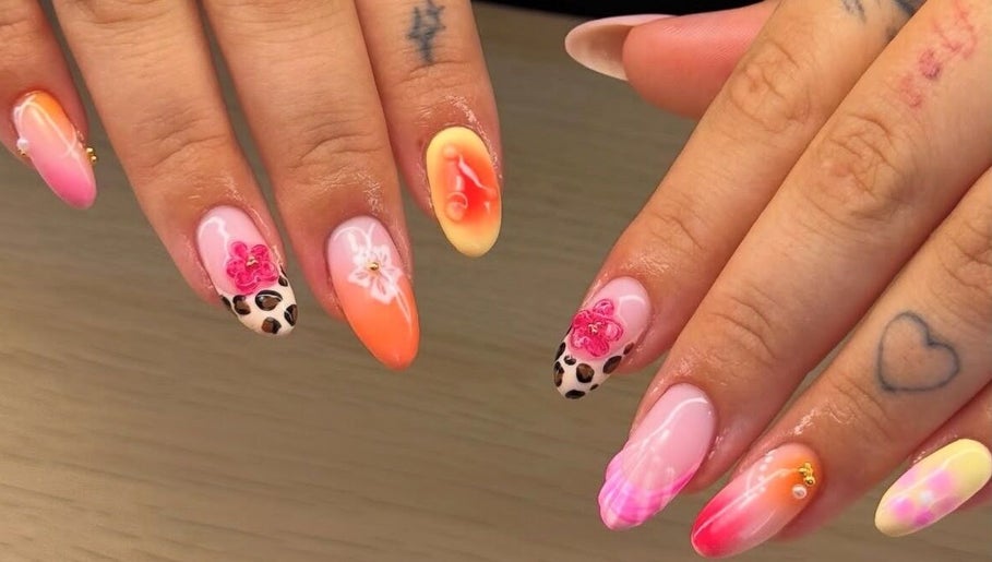 Vibrant floral and leopard nail art at BYGLT in Morriston, Wales, GB. Showcasing unique nail design.