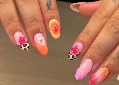 Vibrant floral and leopard nail art at BYGLT in Morriston, Wales, GB. Showcasing unique nail design.