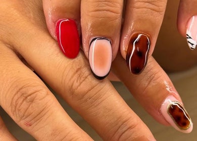 Stylish nail art at BYGLT, Morriston, Wales, GB featuring vivid colors and unique designs.